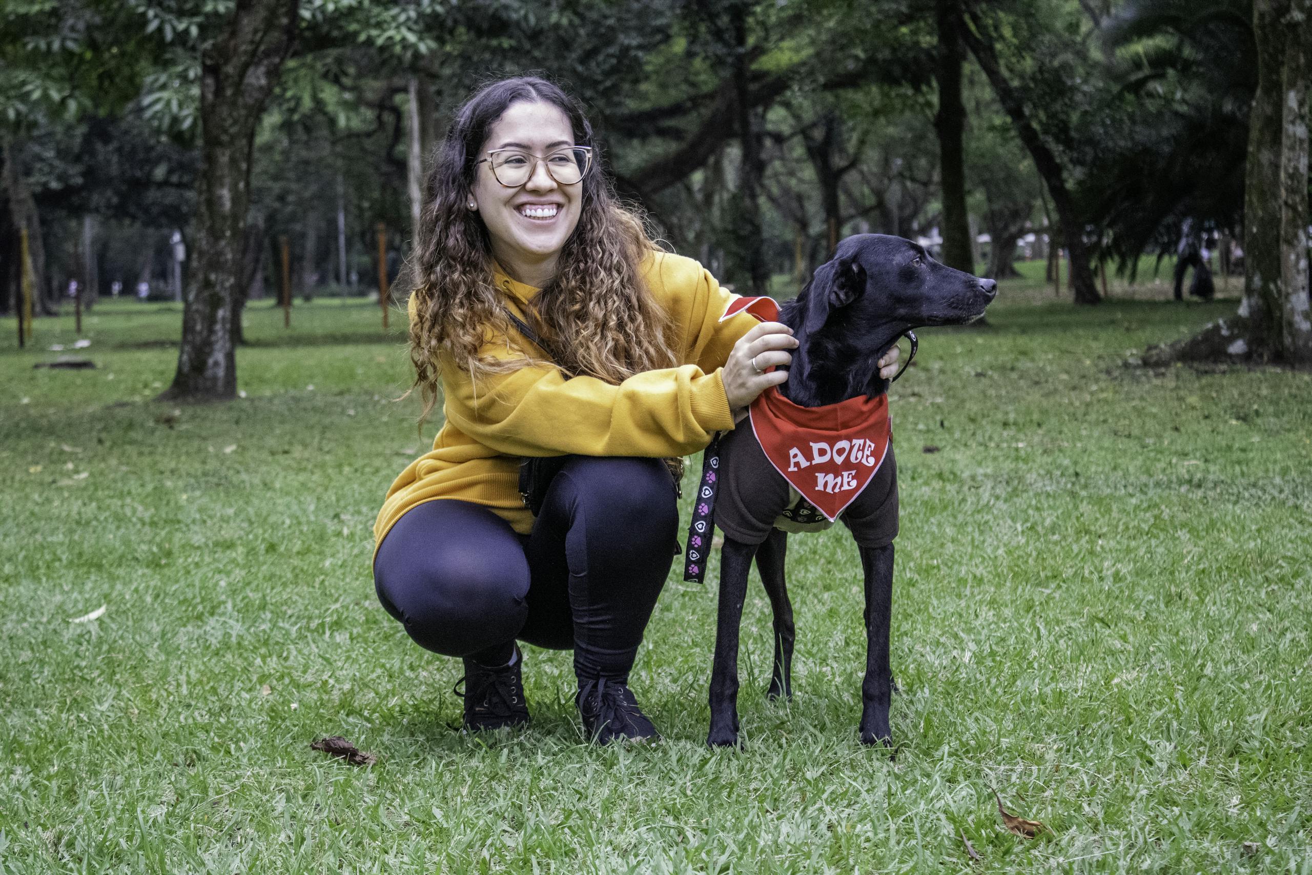 Smiling Woman with Black Dog